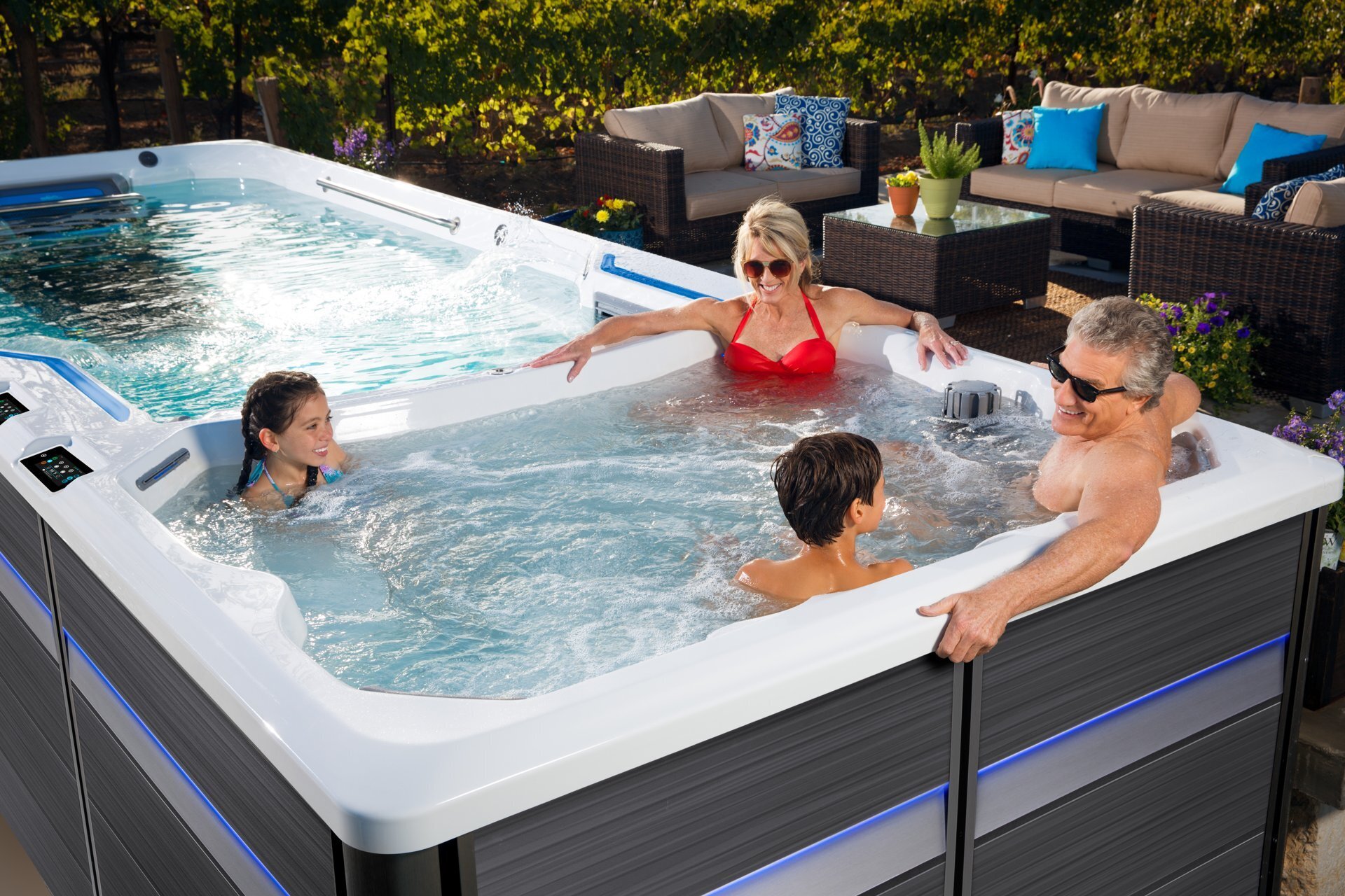 Family enjoying the warm end of an Endless Pools E-Series swim spa