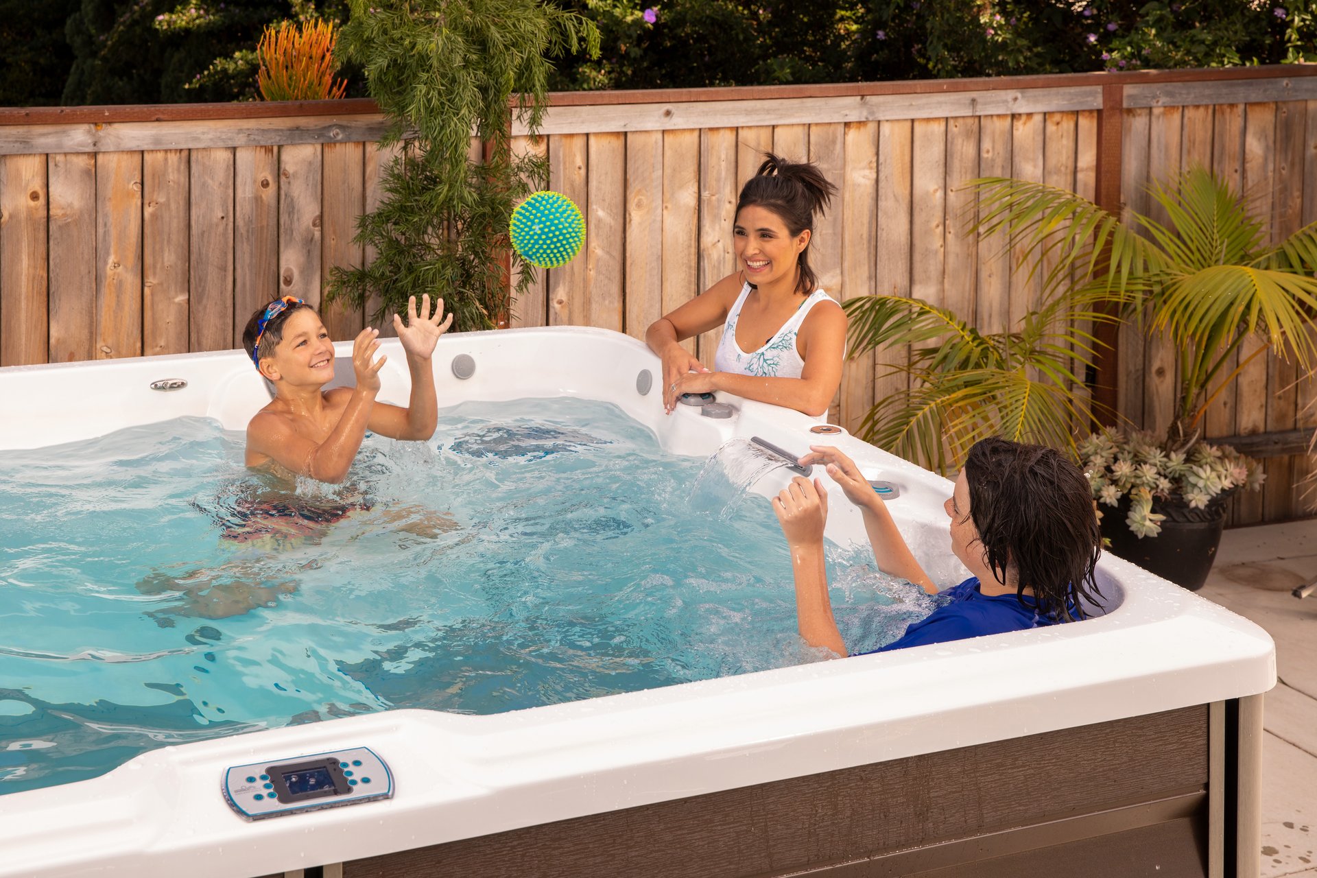 Family playing in an Endless Pools RecSport swim spa