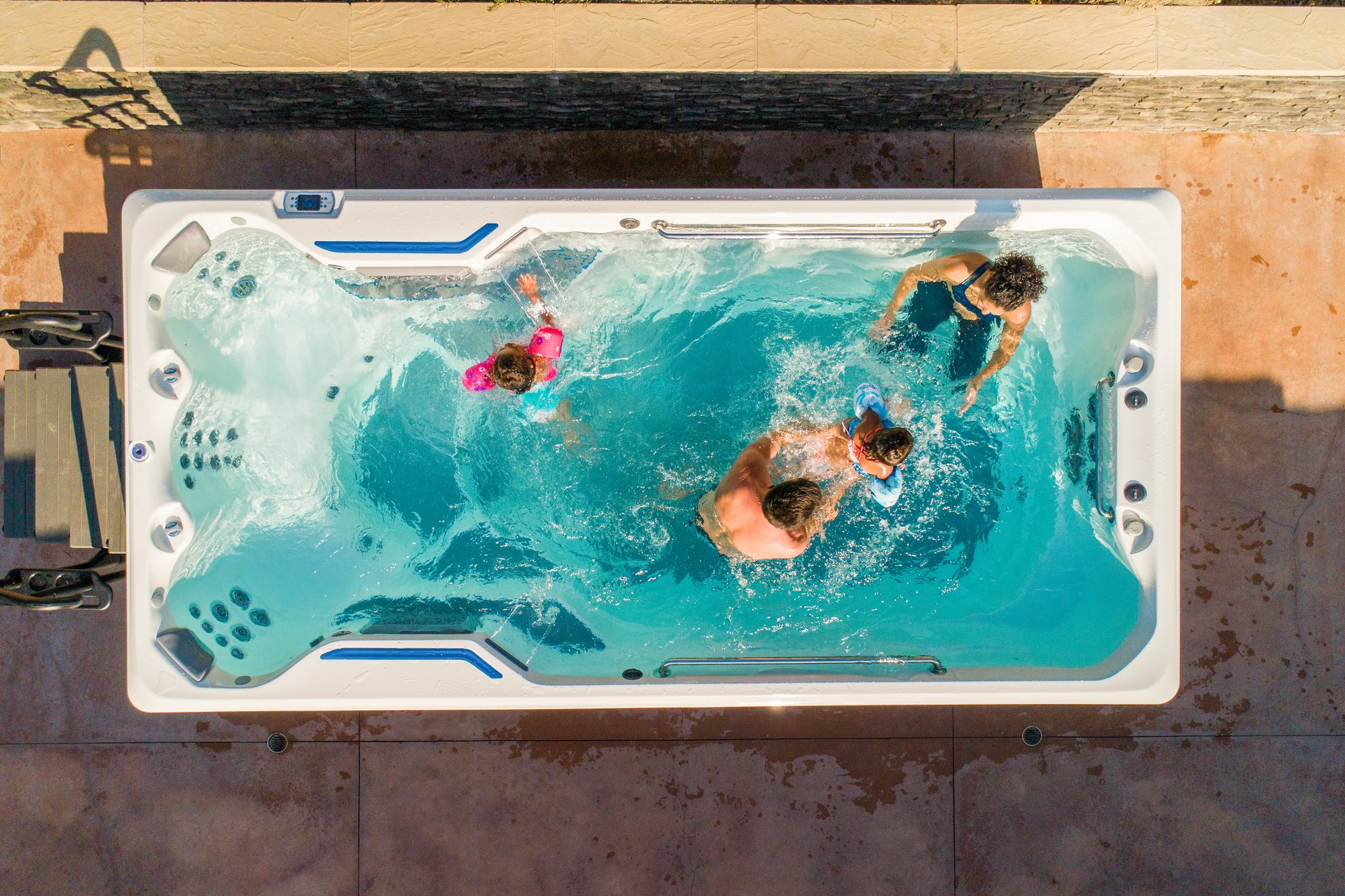 Family enjoying an Endless Pools SwimCross swim spa