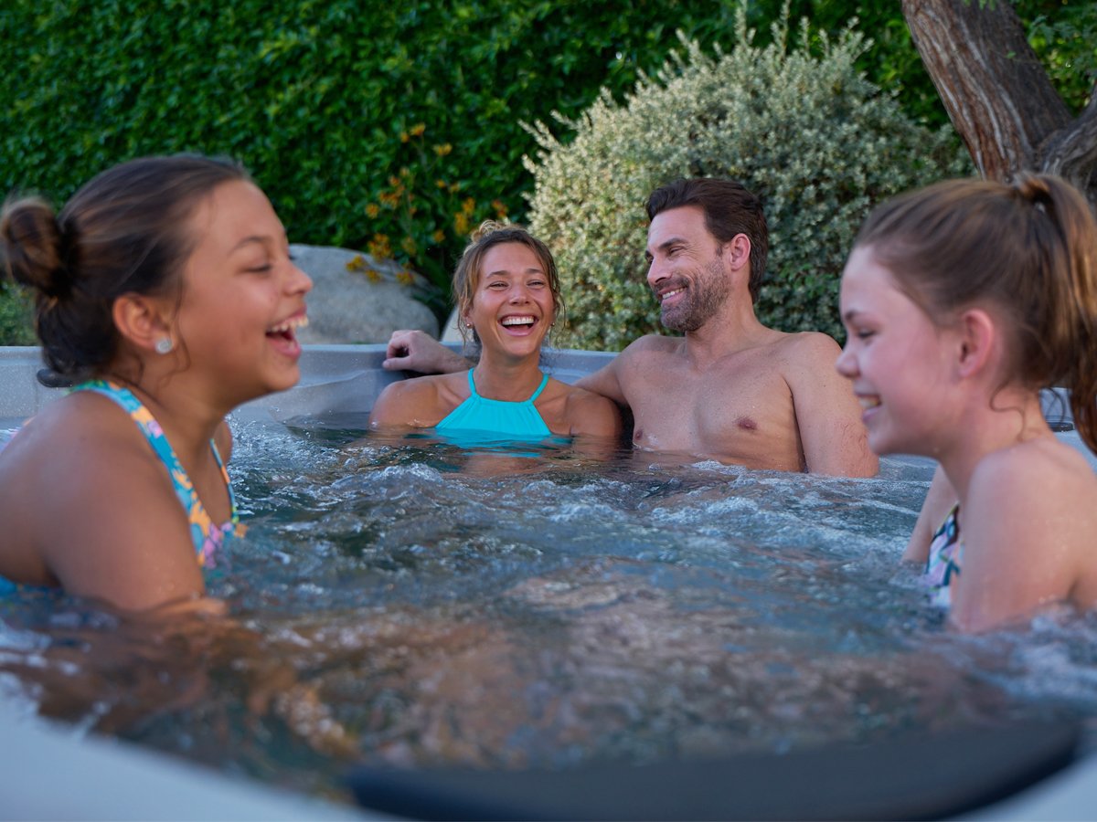 Family enjoying a Hot Spring Freeflow Excursion plug-and-play spa