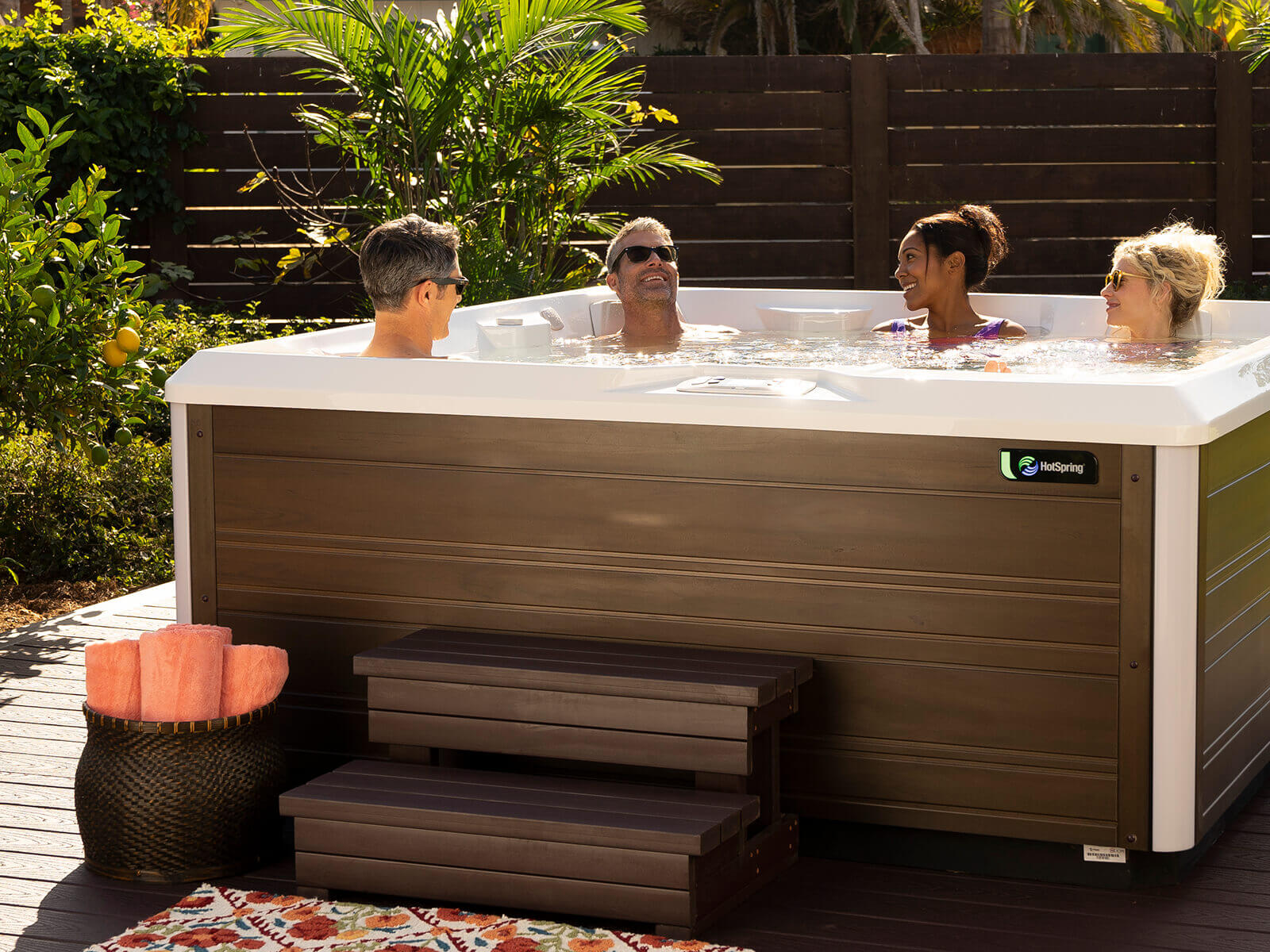 A group relaxing in a Hot Spring Limelight Flash spa