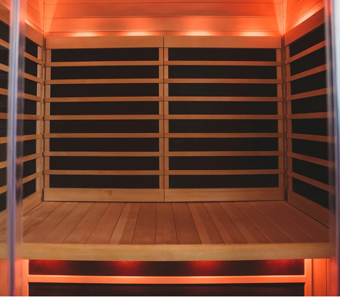 Warmly lit interior of a Tylo infrared sauna cabin